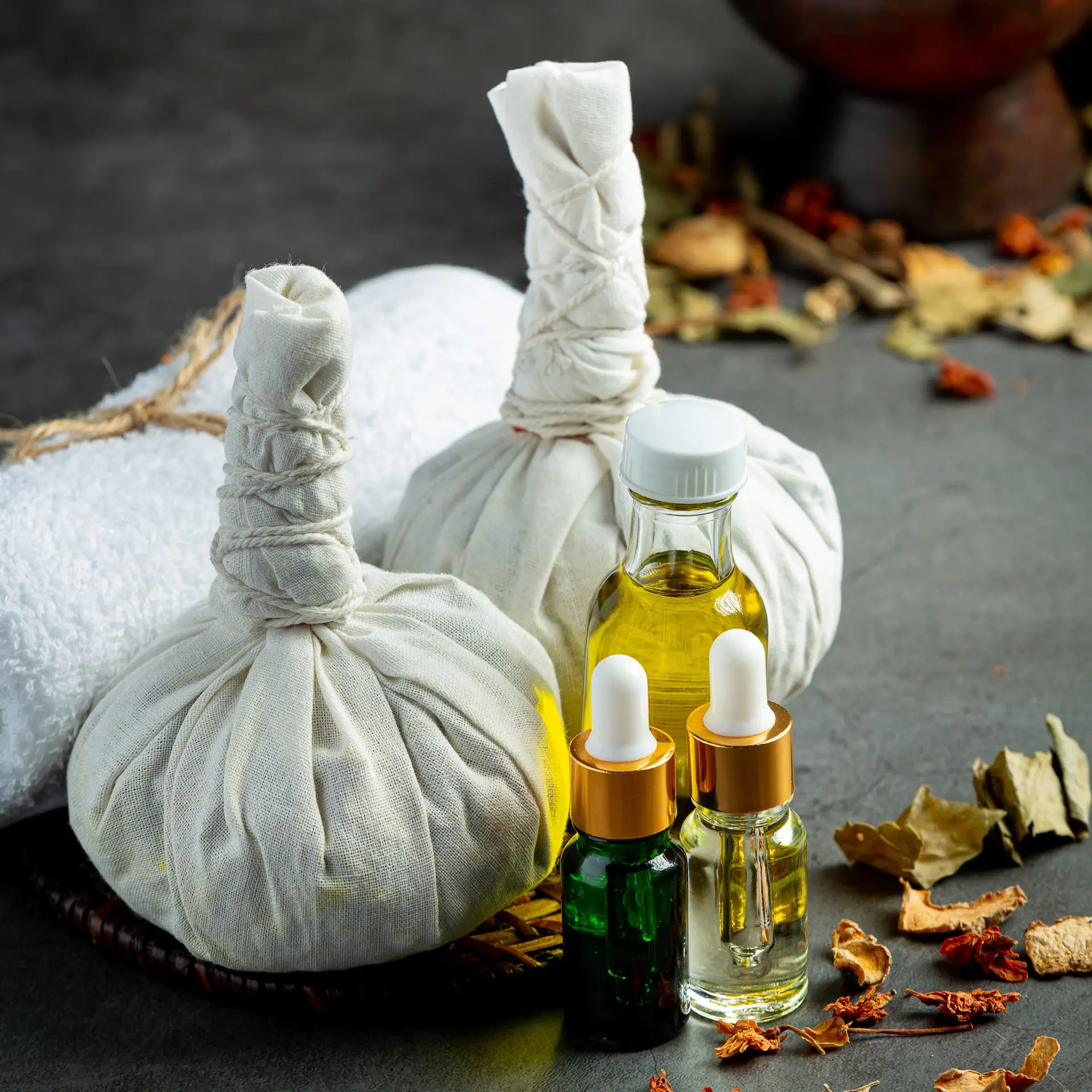 Herbal compress and medicated oils used in Ayurvedic treatment therapy